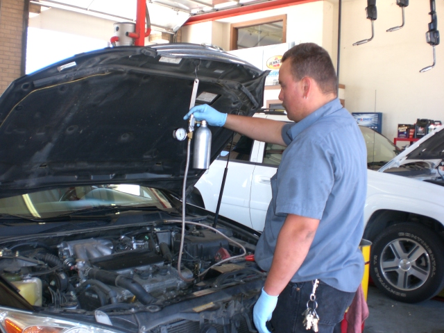 Person checking a car engine
